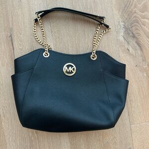 Michael Kors Elegant Black Shoulder Bag with Gold Accents, Jet Set Travel